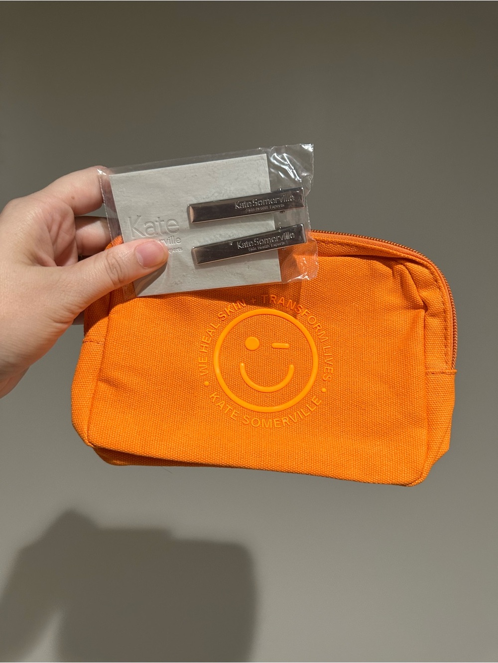 Kate Somerville Bright Orange Canvas Toiletry Pouch and clips